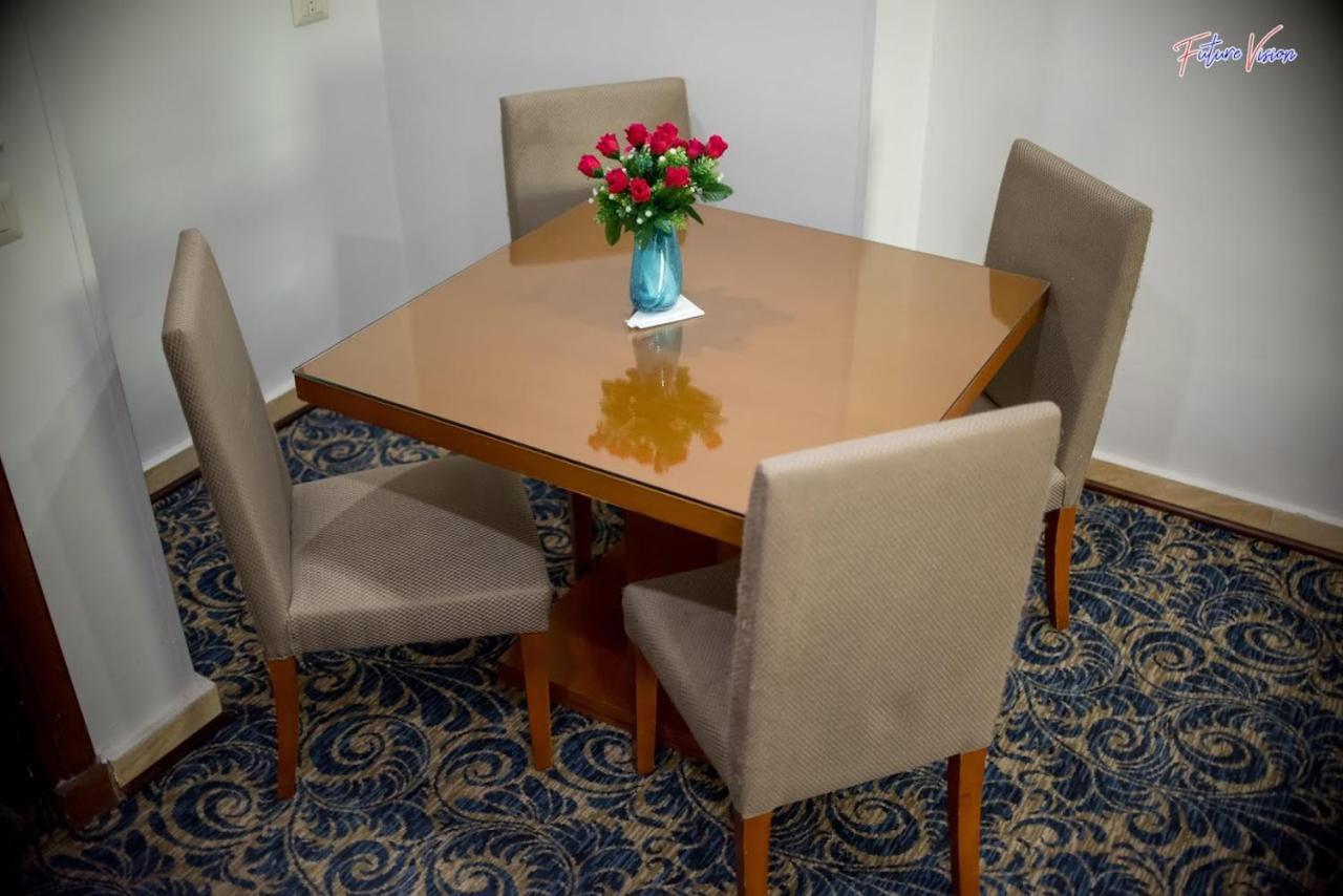 Rehana Plaza Hotel Cairo Exterior photo A dining table with four chairs